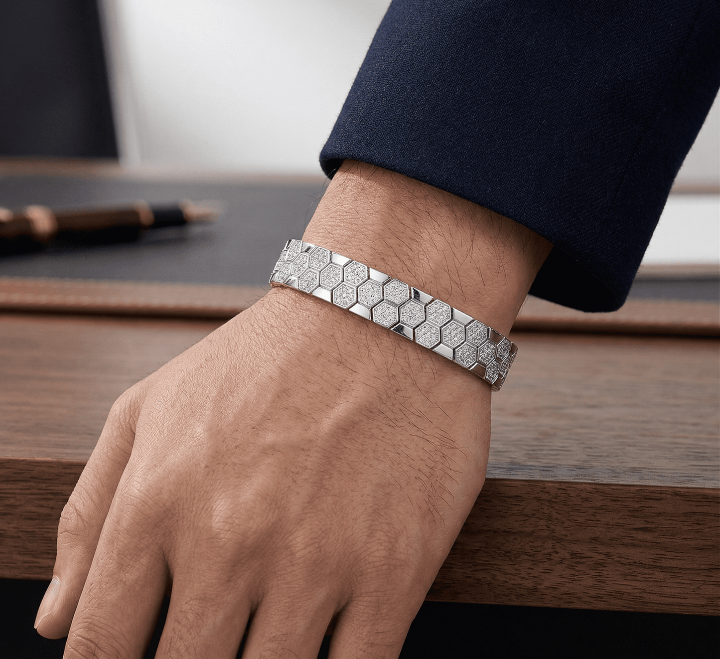 Bee Yourself moissanite bracelet worn on wrist, 800+ hand set stones in 925 sterling silver lifestyle shot.