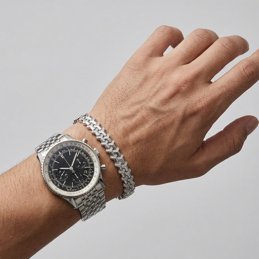 Soldier moissanite bracelet paired with a watch on wrist, hand set melee shield design in sterling silver.