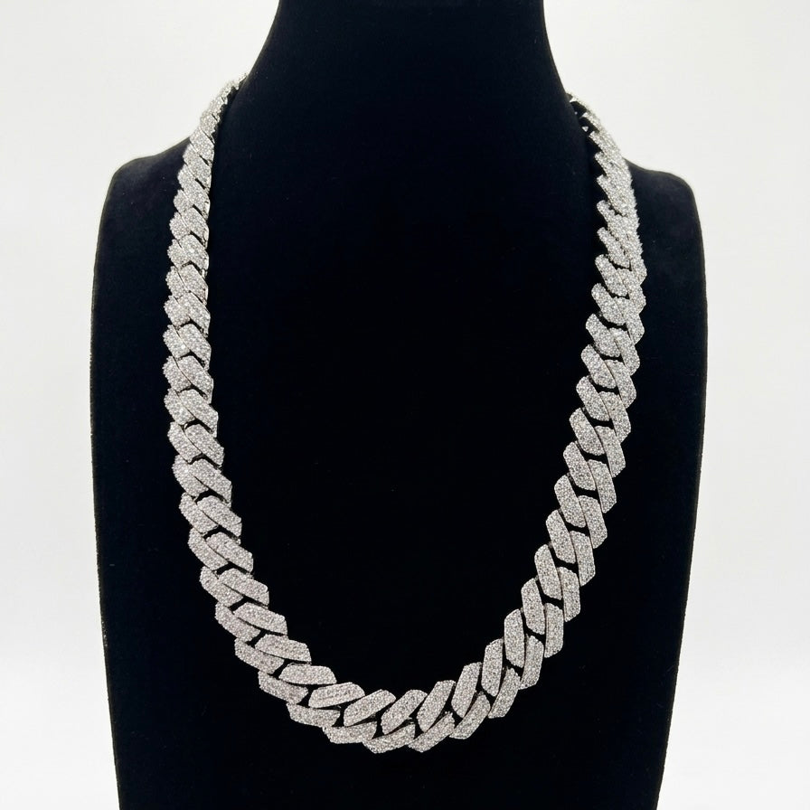 Cuban Silver moisanite chain necklace on a black mannequin against a white background