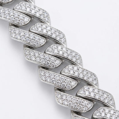 Close-up of a moisanite-encrusted bracelet on a light gray background