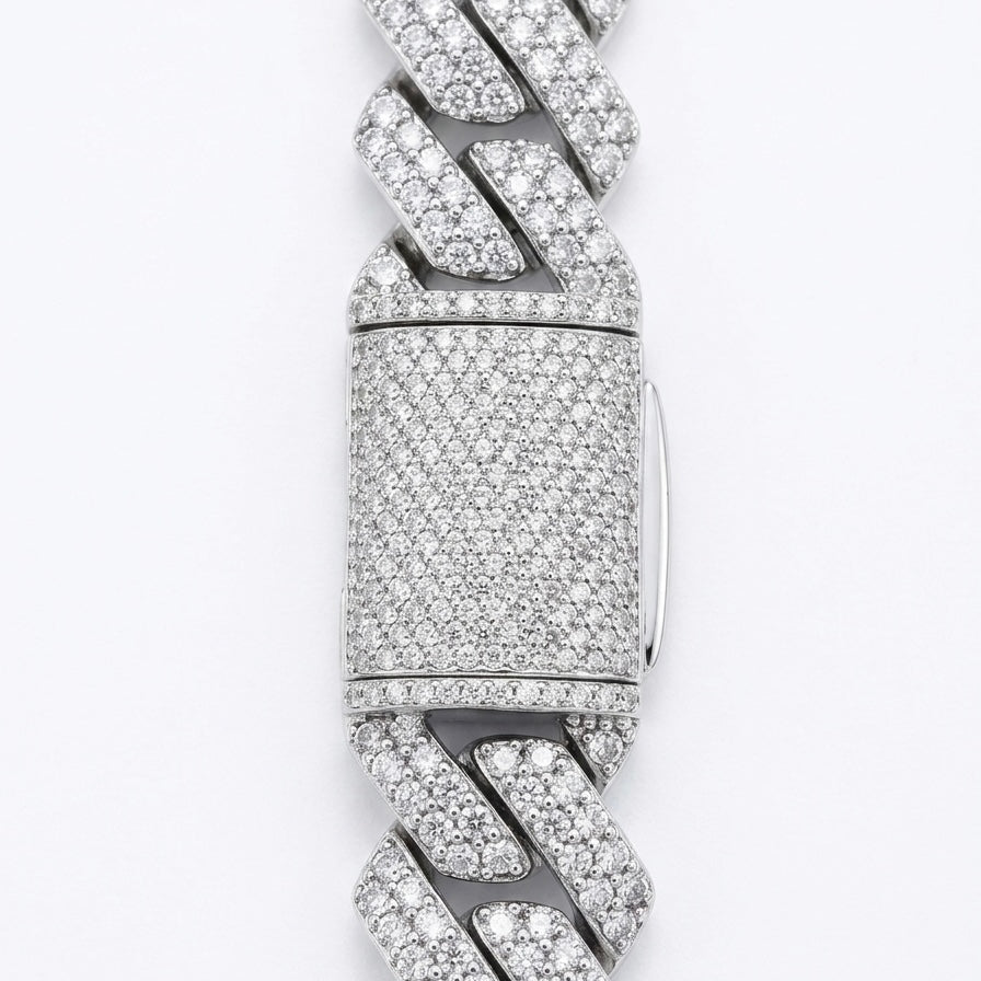 Silver bracelet clasp with moissanite accents on a white background