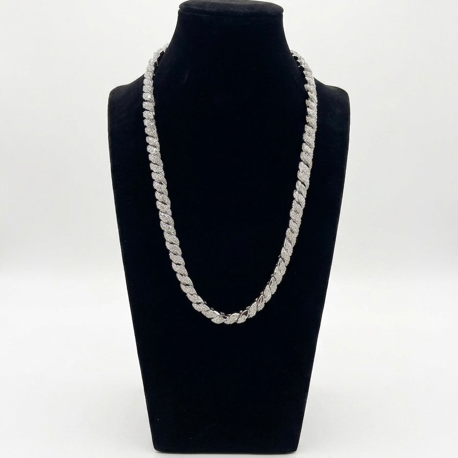 Silver moissanite chain necklace on a black mannequin bust against a white background