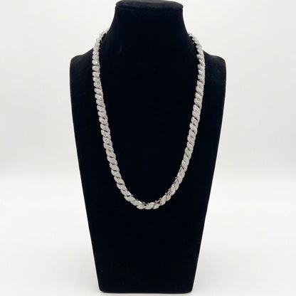 Silver moissanite chain necklace on a black mannequin bust against a white background