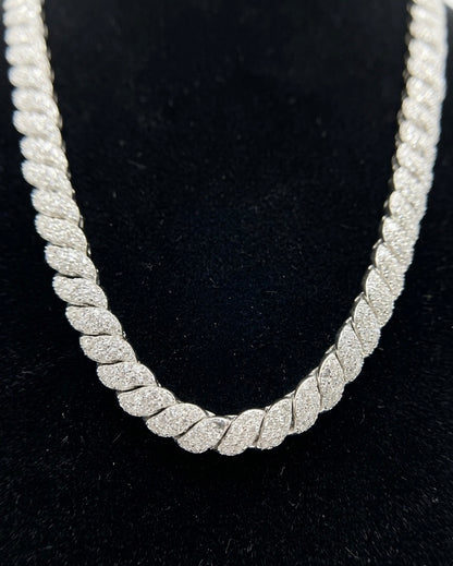 Silver rope chain moissanite necklace on a black background