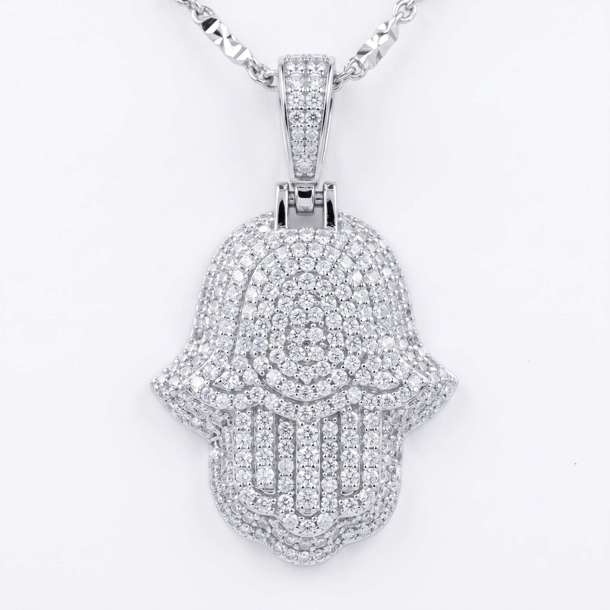 Silver Hamsa hand pendant with clear moissanite stones on a white background