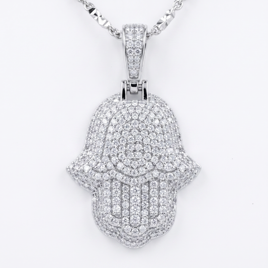 Silver Hamsa hand pendant with clear moissanite stones on a white background