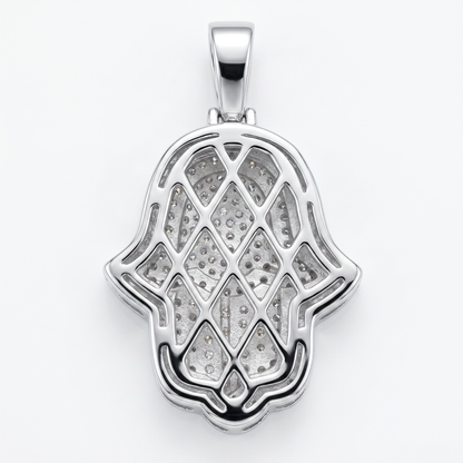 Silver Hamsa pendant with embedded moissanite on a white background