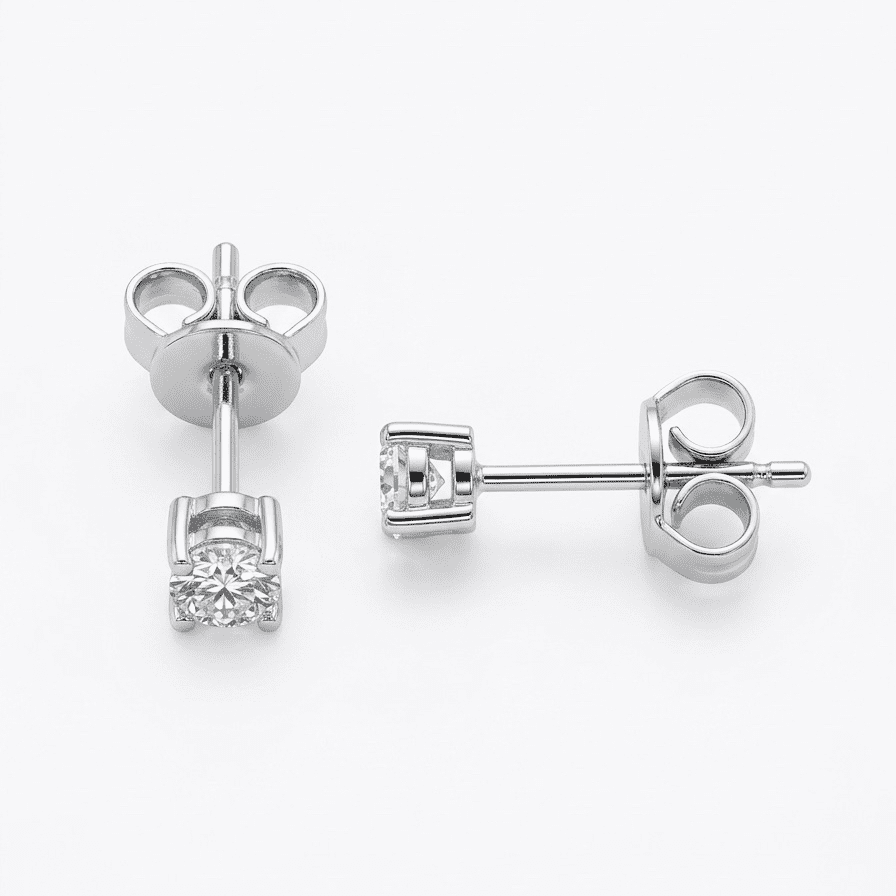 Pair of silver moissanite stud earrings with clear gemstones on a white background
