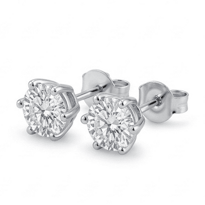 Pair of moissanite stud earrings on a white background