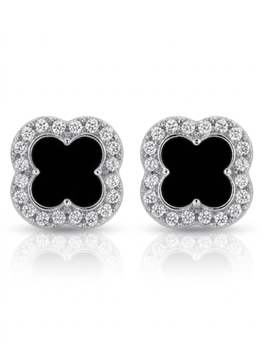 Pair of earrings with black clover-like centers and diamond-studded silver borders on a white background.