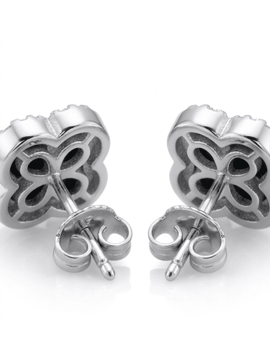 Silver clover-shaped earrings on a white background