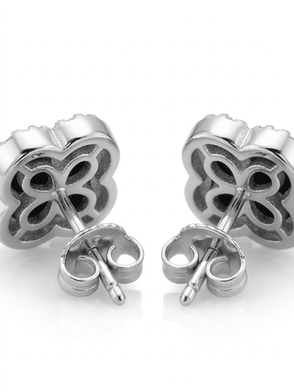 Silver clover-shaped earrings on a white background