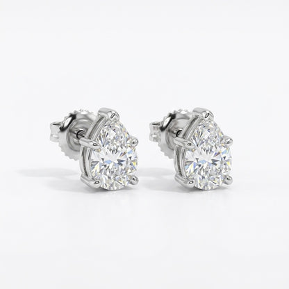 Pair of pear shape diamond stud earrings on a white background