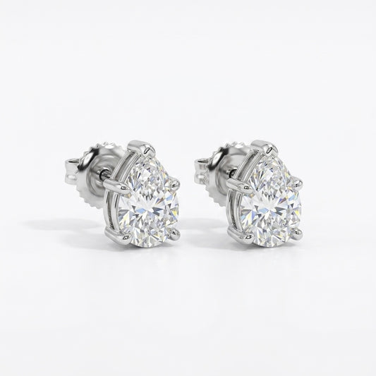 Pair of pear shape diamond stud earrings on a white background