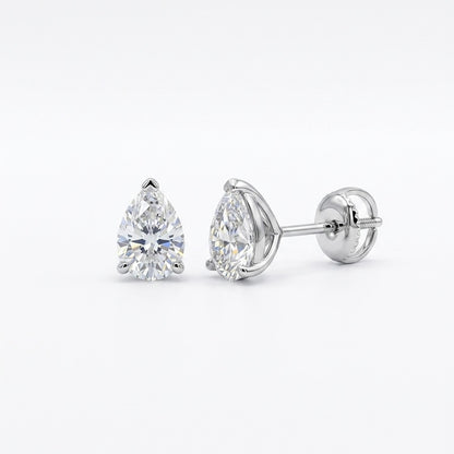 Pair of pear-shaped diamond stud earrings on a white background