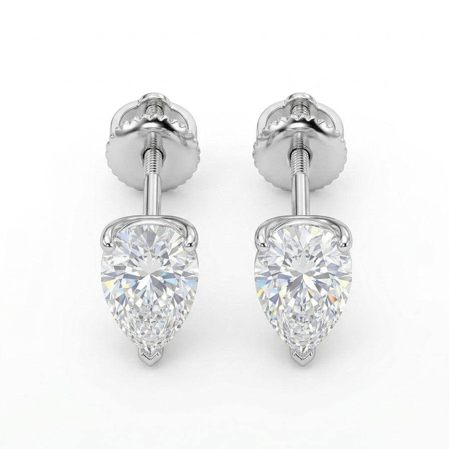 Pair of pear-shaped diamond earrings on a white background