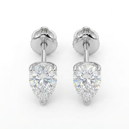 Pair of pear-shaped diamond earrings on a white background