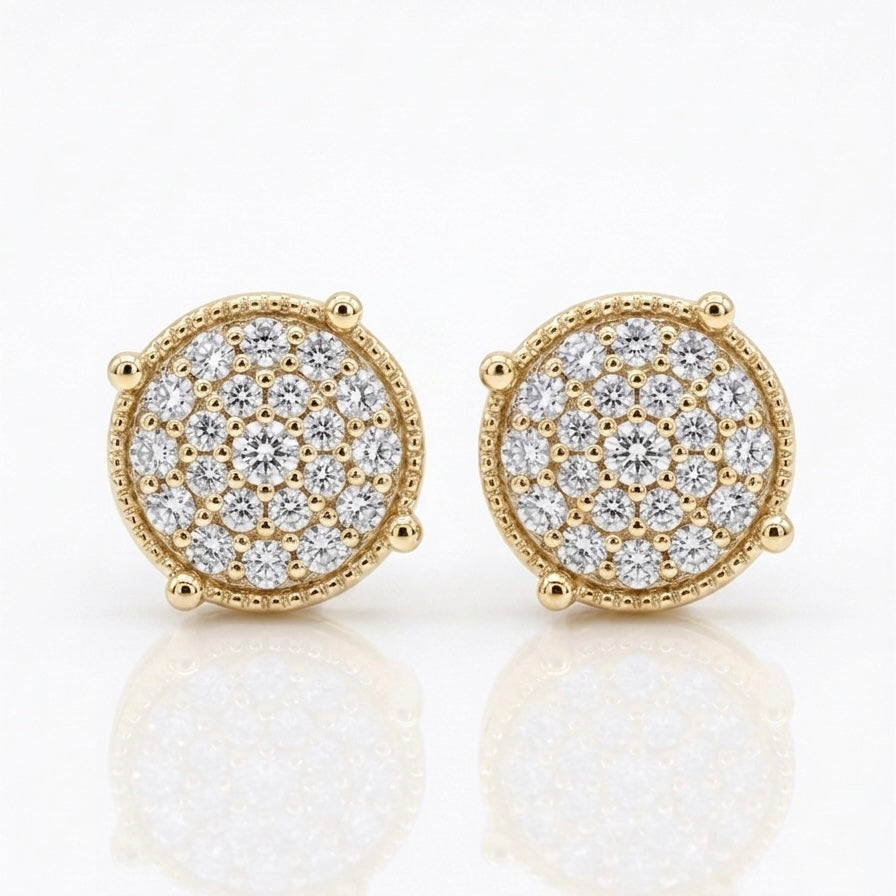 A pair of Maverick moissanite stud earrings in 18K yellow gold plated sterling silver on white background.