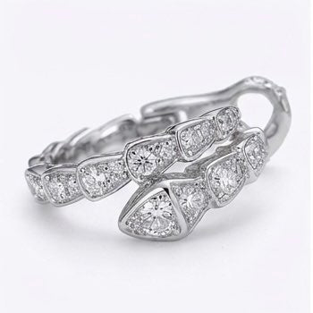 Close-up of hand set moissanite hoop earrings in sterling silver, showcasing sparkling stone detail.