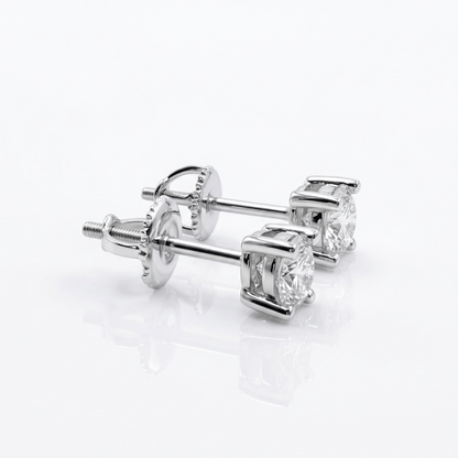 Pair of moissanite stud earrings on a white background