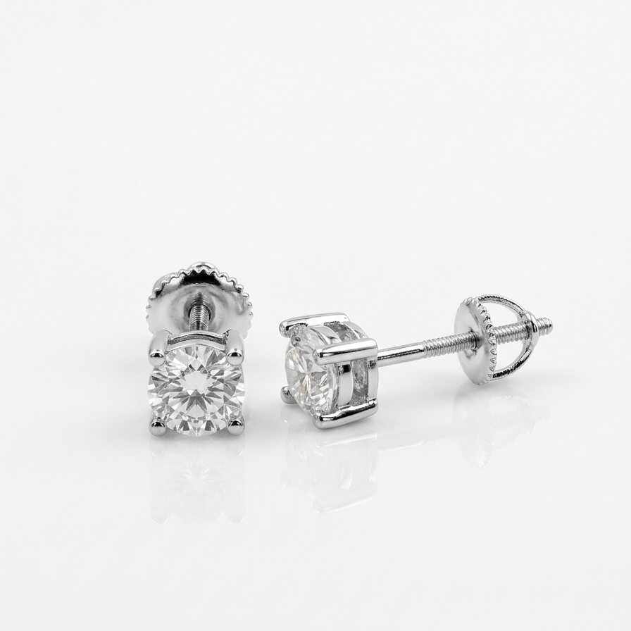 Pair of round moissanite stud earrings on a white background