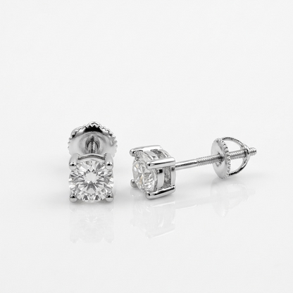 Pair of round moissanite stud earrings on a white background
