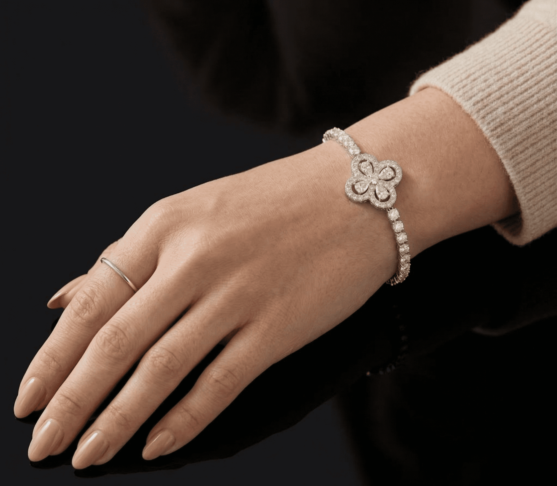 Dazzle moissanite bracelet worn on wrist, 4.5ctw hand set in 925 sterling silver elegant lifestyle shot.