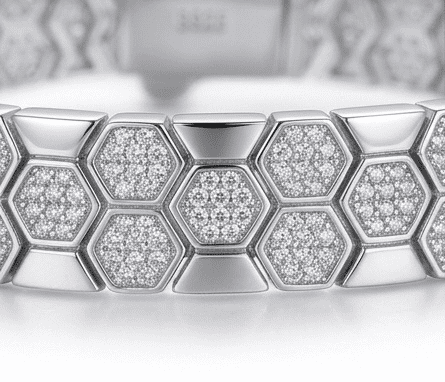 Close-up of Bee Yourself moissanite bracelet showcasing intricate 800+ hand set stone bee design in sterling silver.