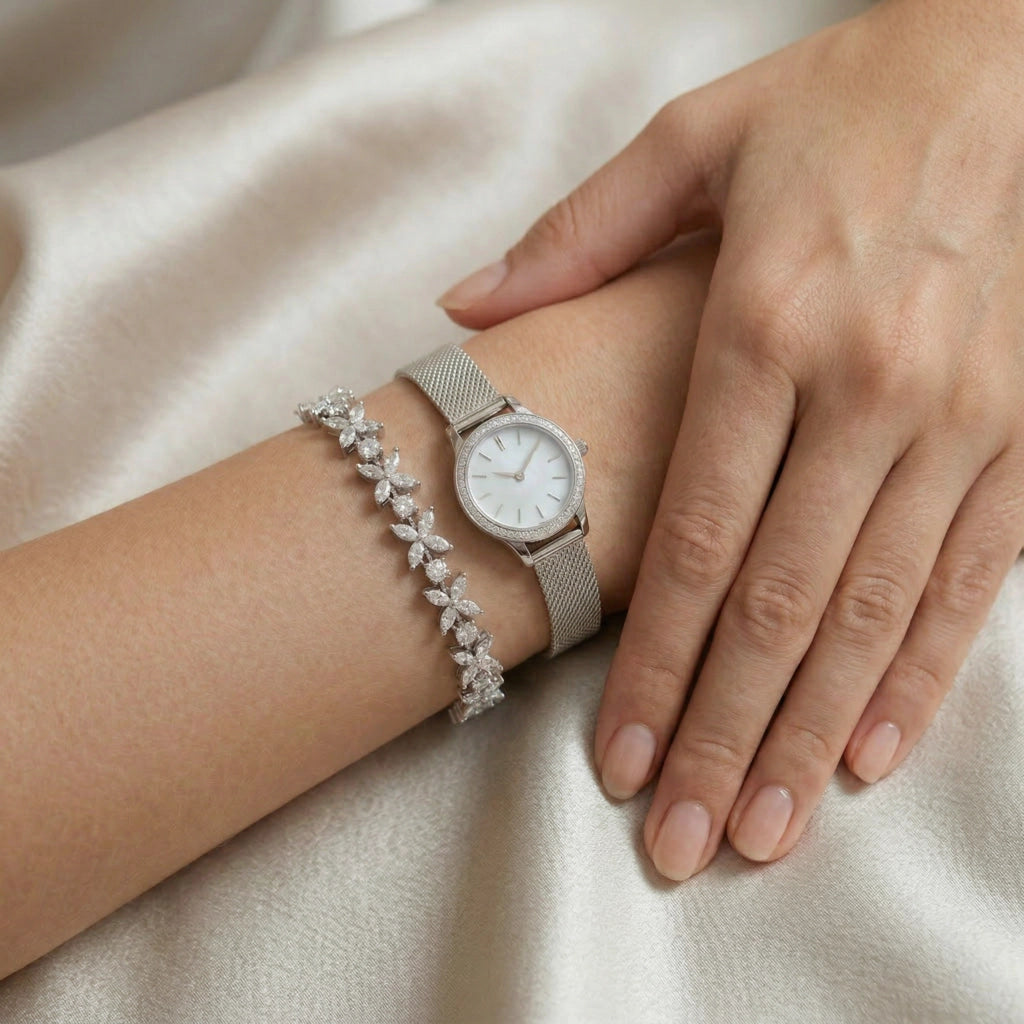 Luminary moissanite butterfly bracelet worn on wrist pairing with watch, 8.5ctw hand set in 925 sterling silver lifestyle shot.