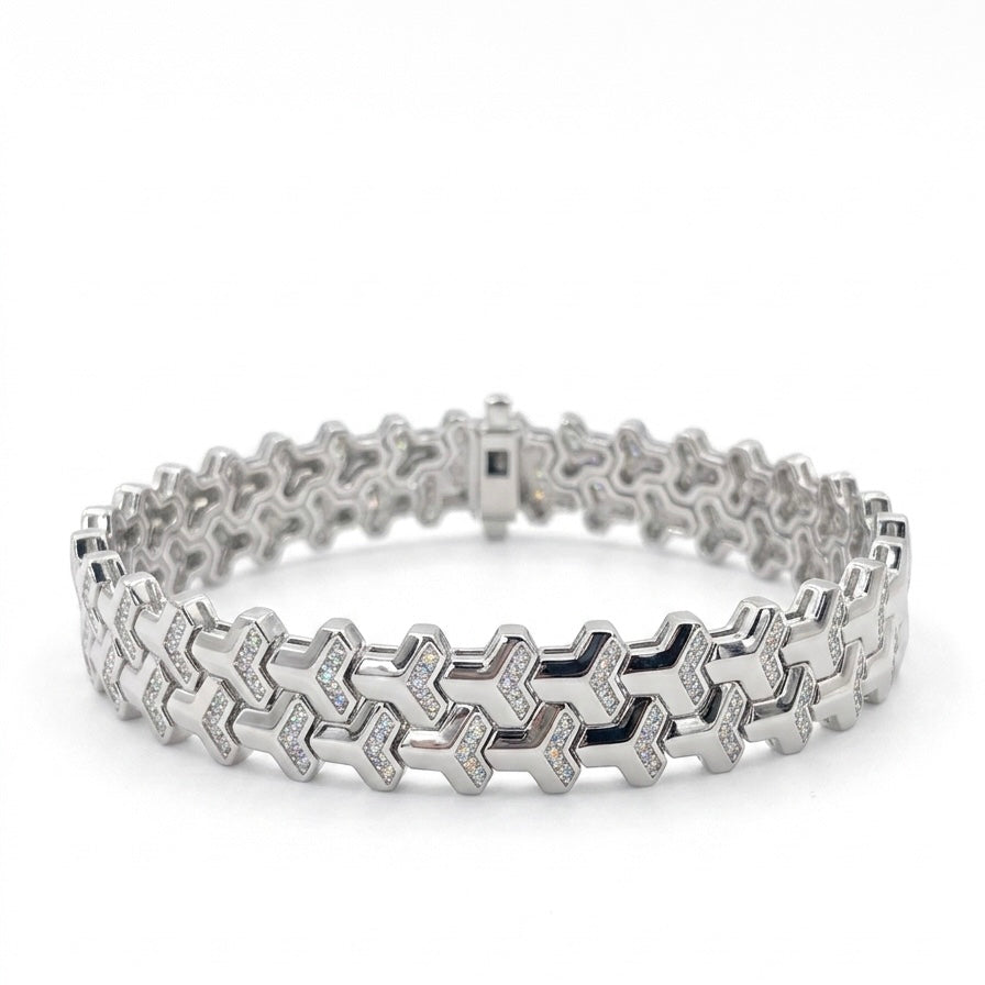 Soldier moissanite bracelet with shield design, fully hand set melee stones in 925 sterling silver on white background.