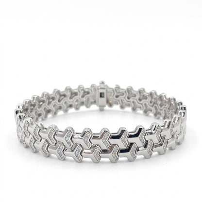Soldier moissanite bracelet with shield design, fully hand set melee stones in 925 sterling silver on white background.