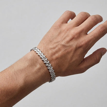 Soldier moissanite bracelet worn on male model's wrist, fully hand set melee in 925 sterling silver.