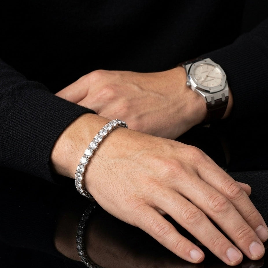Moissanite tennis bracelet worn on men's wrist paired with a watch, 10–15ctw sterling silver.