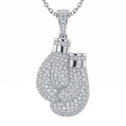Silver moissanite boxing glove pendant on a chain against a white background