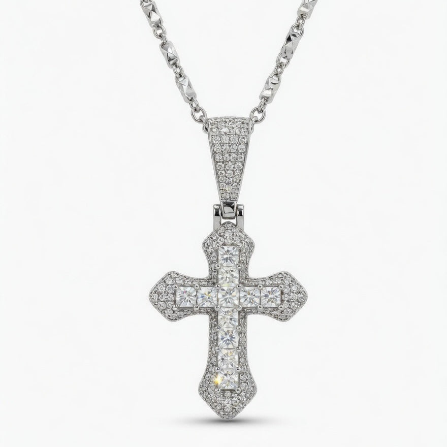 moissanite cross pendant on a chain against a white background