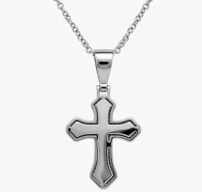 Silver cross pendant on a chain against a white background