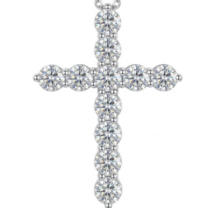 Silver moissanite cross pendant on a white background