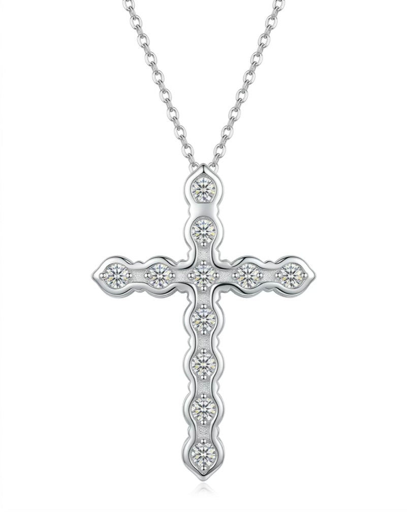 Silver cross pendant necklace on a white background