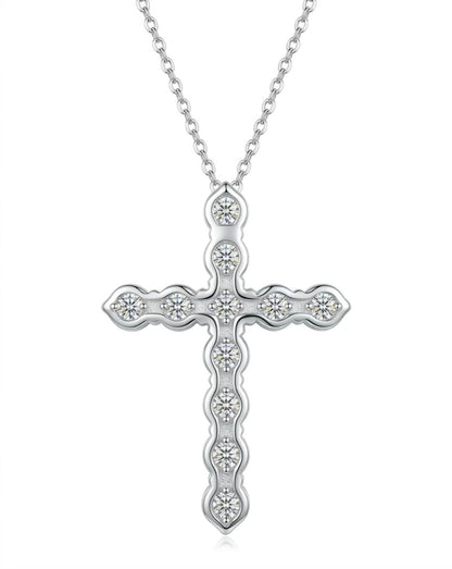 Silver cross pendant necklace on a white background