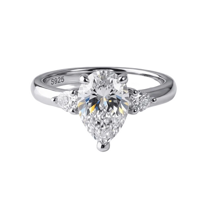 Aurora 2ct pear moissanite ring, 2.2ctw hand set in sterling silver band, front view on white background.