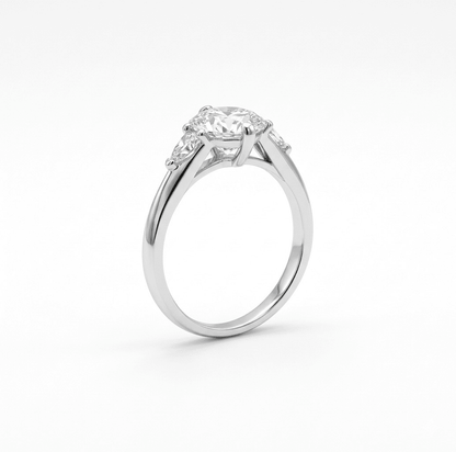 Aurora 2ct pear moissanite ring standing upright, 2.2ctw in sterling silver band front view.
