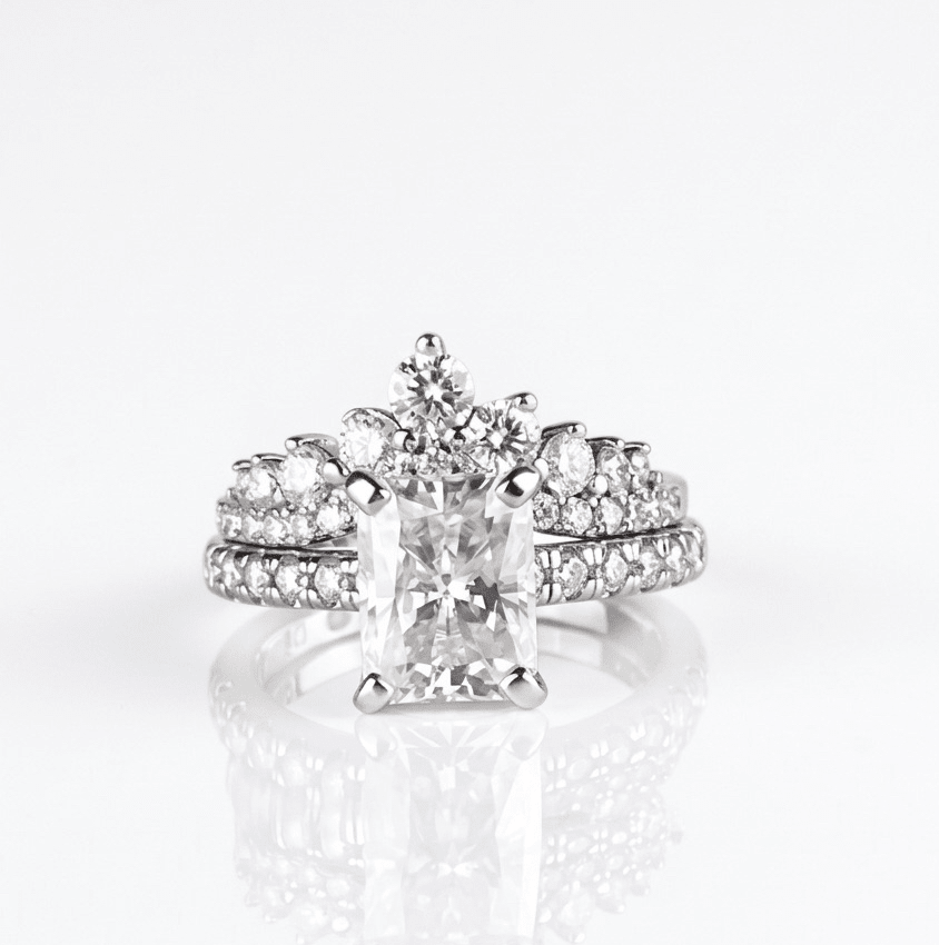 Evermore moissanite cluster ring paired with fully radiant moissanite ring, stacked styling in 925 sterling silver.
