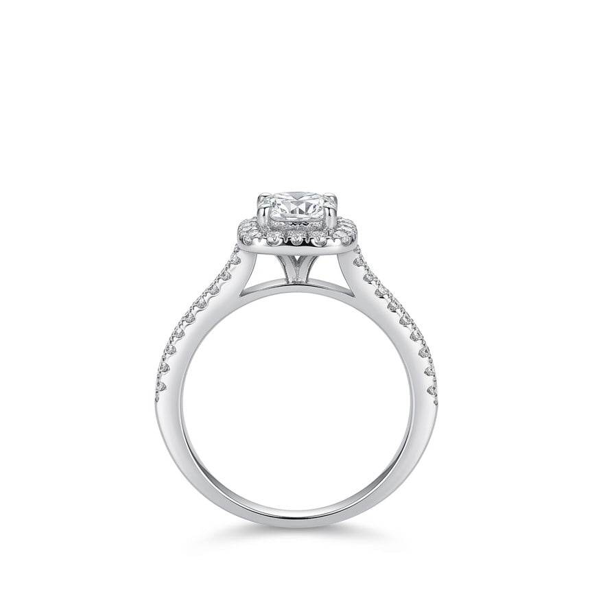 Silver ring with a moisanite on a white background