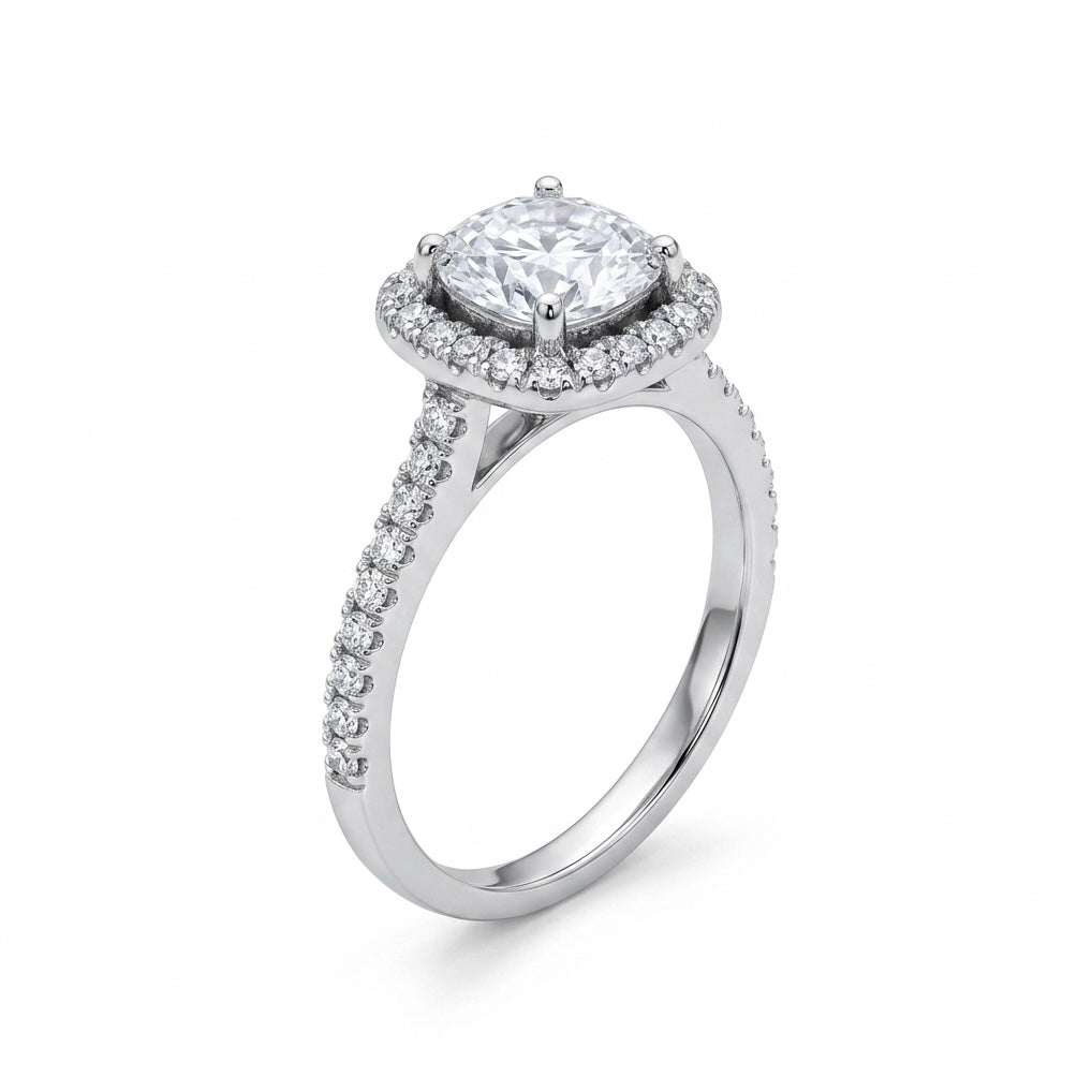 Diamond ring with a central gemstone and halo on a white background