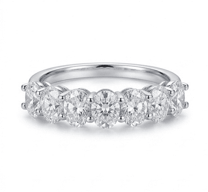 Sevenfold moissanite ring featuring 7 oval stones, fully hand set in 925 sterling silver, front view on white background