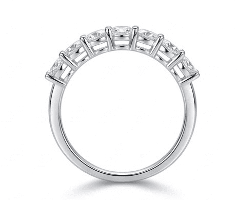 Sevenfold moissanite ring standing upright, 7 oval stones hand set in 925 sterling silver front view.