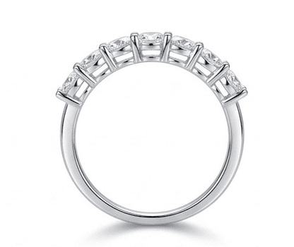 Sevenfold moissanite ring standing upright, 7 oval stones hand set in 925 sterling silver front view.