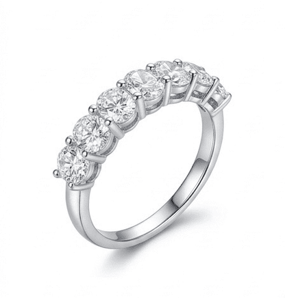 45-degree view of Sevenfold moissanite ring showcasing 7 brilliant oval moissanite stones in sterling silver.
