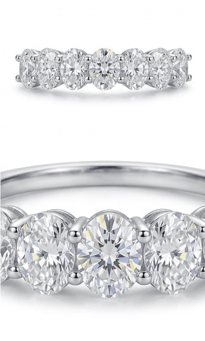 Close-up of Sevenfold moissanite ring revealing intricate 7 oval stone hand set detail in 925 sterling silver.