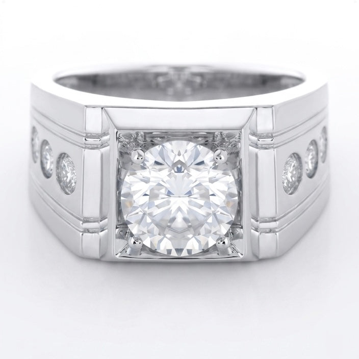 Silver ring with a 2ct round briliant central diamond and smaller diamonds on the sides against a white background